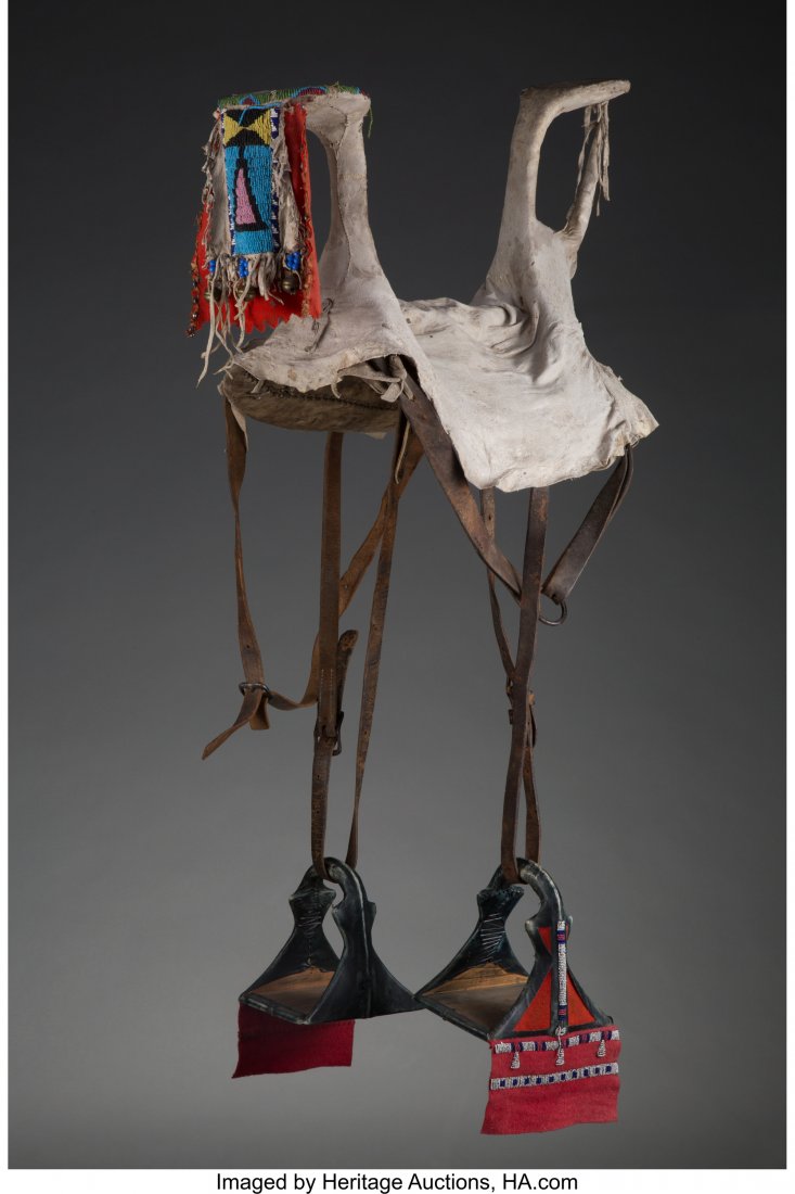 A Crow Woman's Parade Saddle c. 1890  wood, hide (1 of 2)