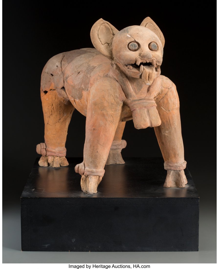 A Veracruz Jaguar c. 600 - 900 AD Reddish clay: A Veracruz Jaguar c. 600 - 900 ADReddish clay with black pigment on eyes, standin