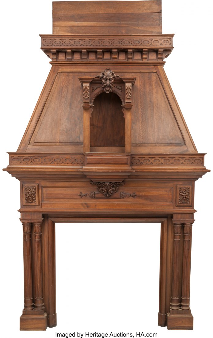 A Monumental Renaissance Revival Carved Walnut F: A Monumental Renaissance Revival Carved Walnut Fireplace Mantel and Hood, late 19th century