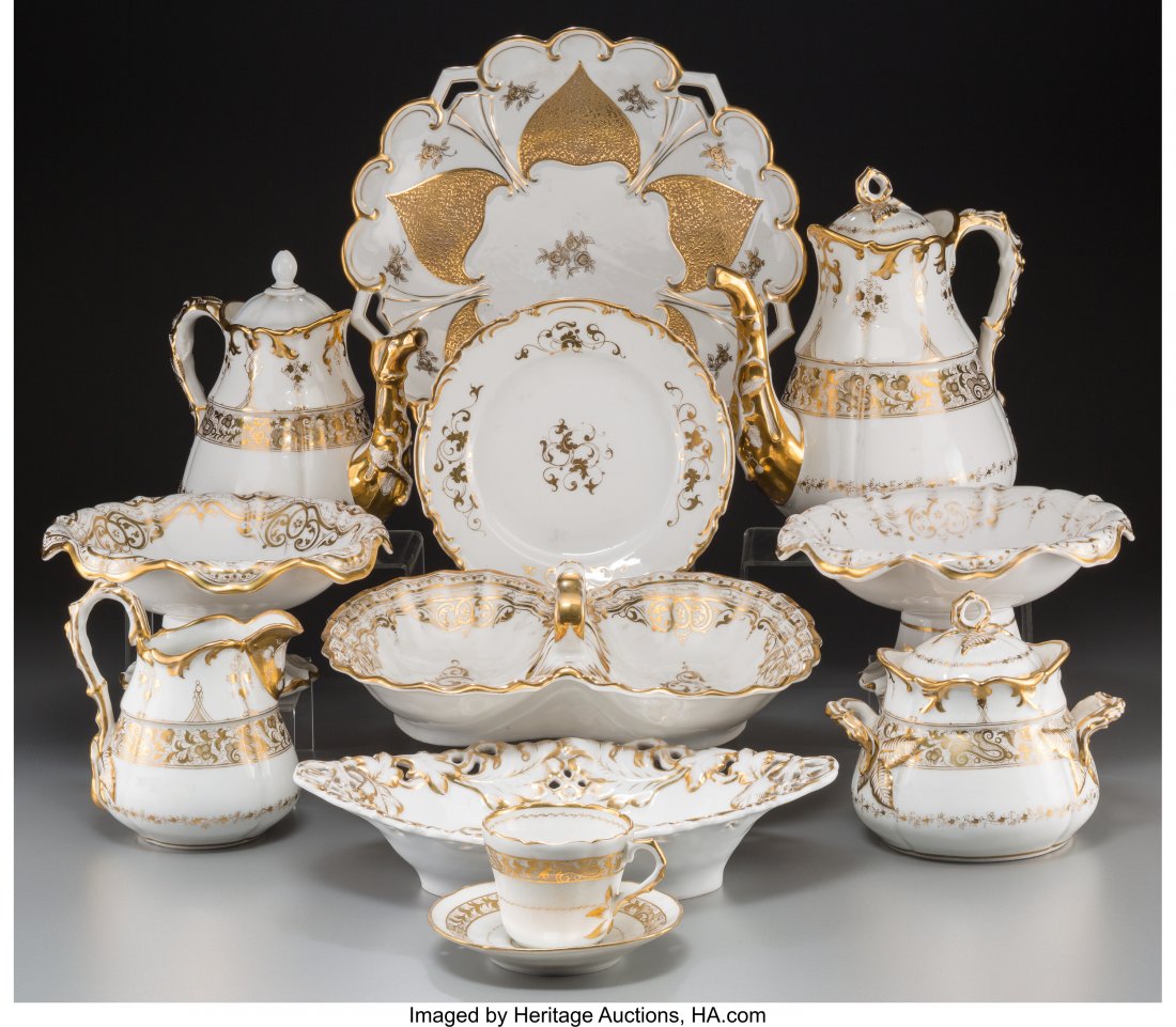 A Forty-Four Piece Continental White and Gold Po: A Forty-Four Piece Continental White and Gold Porcelain Dinner Service, 19th century 12 inc