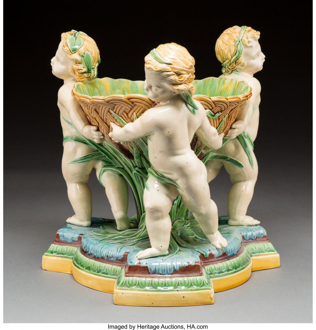 A Large Minton Majolica Figural Centerpiece with: A Large Minton Majolica Figural Centerpiece with Aquatic Putti Motifs, Stoke-on-Trent, St