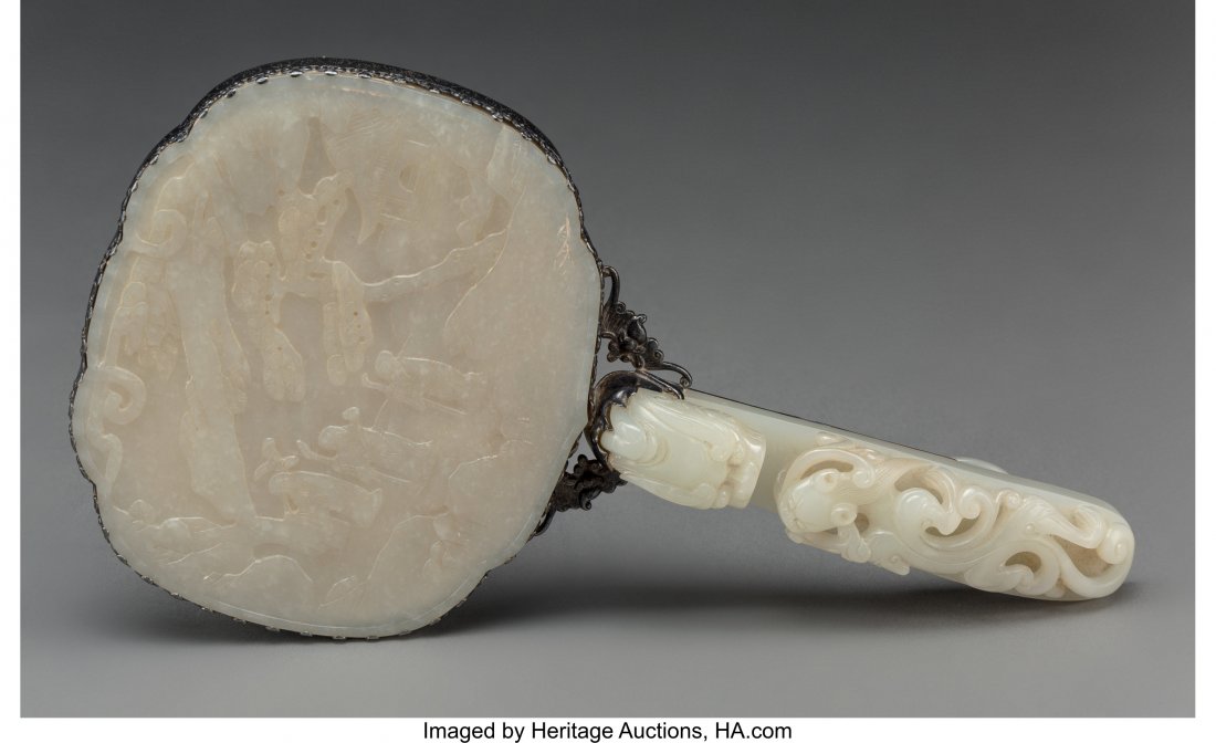 A Chinese Silver and Pale Jade Buckle Hand Mirro: A Chinese Silver and Pale Jade Buckle Hand Mirror, late Qing Dynasty, jade elements possibly e