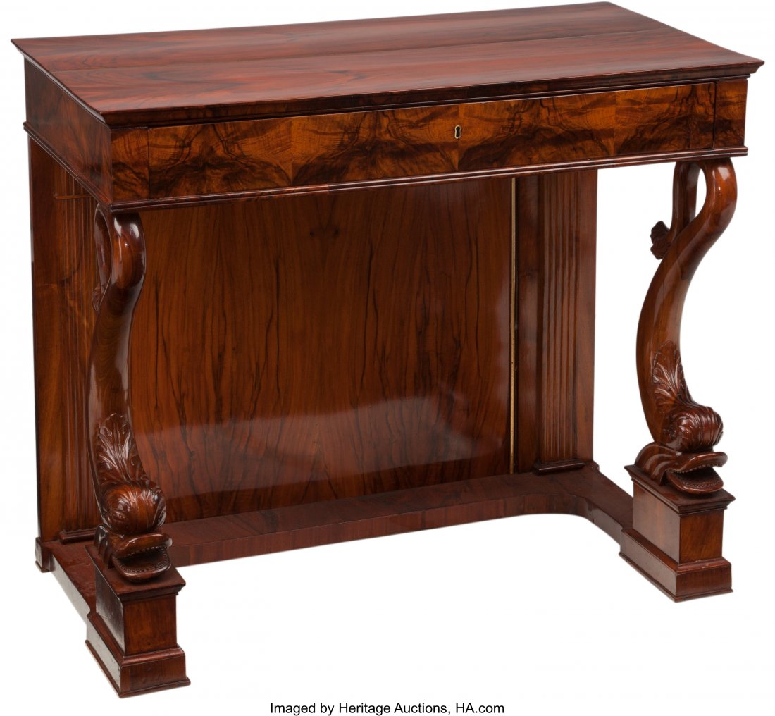 A Neoclassical Biedermeier Mahogany Console with: A Neoclassical Biedermeier Mahogany Console with Dolphin Motif, early 19th century 41 h x 3
