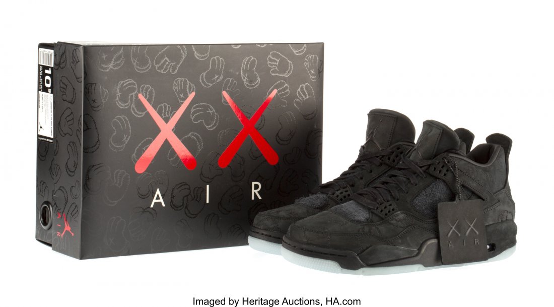 KAWS X Nike Air Jordan 4, 2017 Black sneakers wi: KAWS X NikeAir Jordan 4, 2017Black sneakers with glow in the dark soles, si