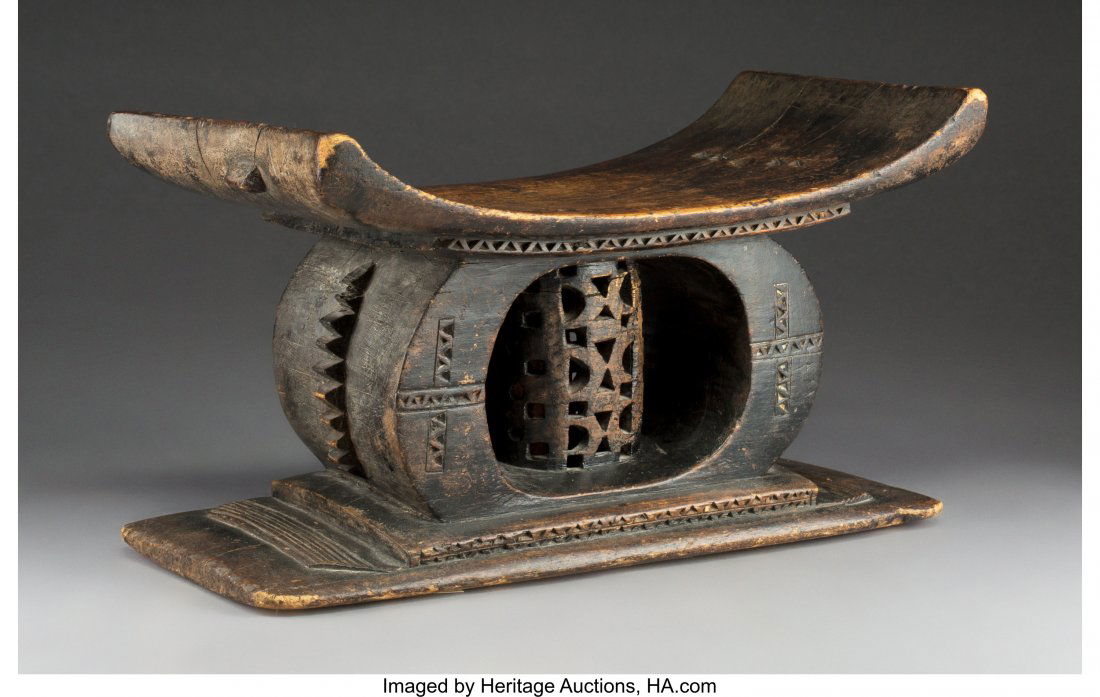 An Akan Carved Wood Stool An Akan stool of cla: An Akan Carved Wood Stool An Akan stool of classical form, likely Ashanti. The co