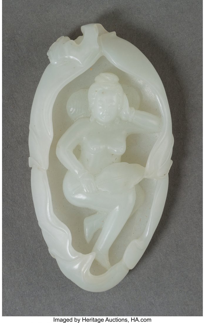 A Chinese White Jade Erotic Carving of a Woman R: A Chinese White Jade Erotic Carving of a Woman Reclining in a Lotus Leaf 2-5/8 inches high