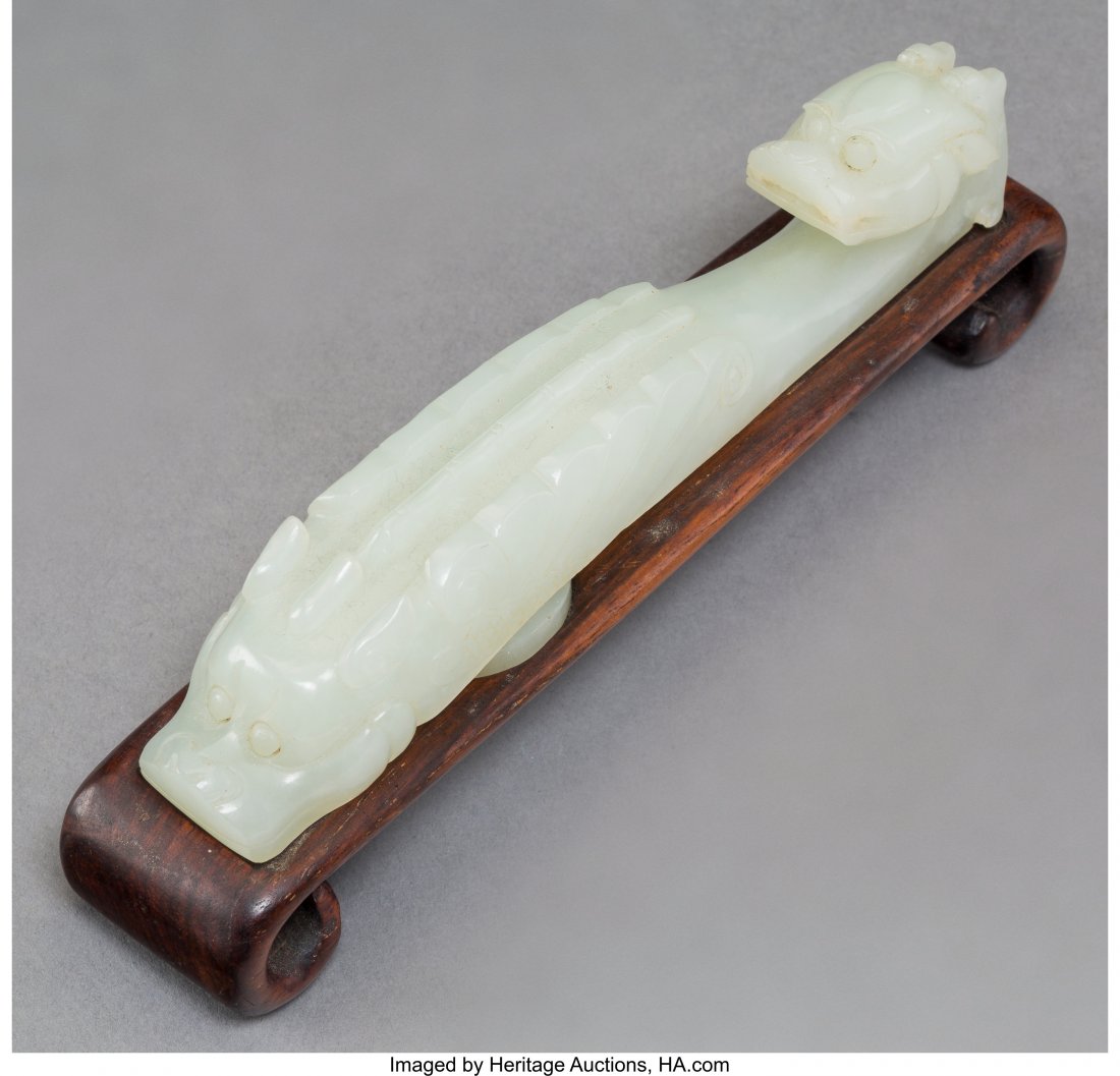 A Chinese Carved White Jade Double Dragon Garmen (1 of 4)
