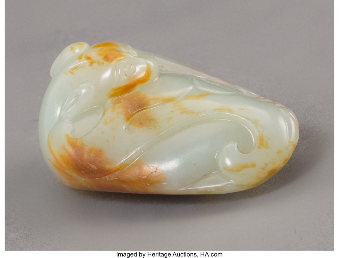 A Chinese Pale Green and Russet Jade Bat Toggle, (1 of 3)