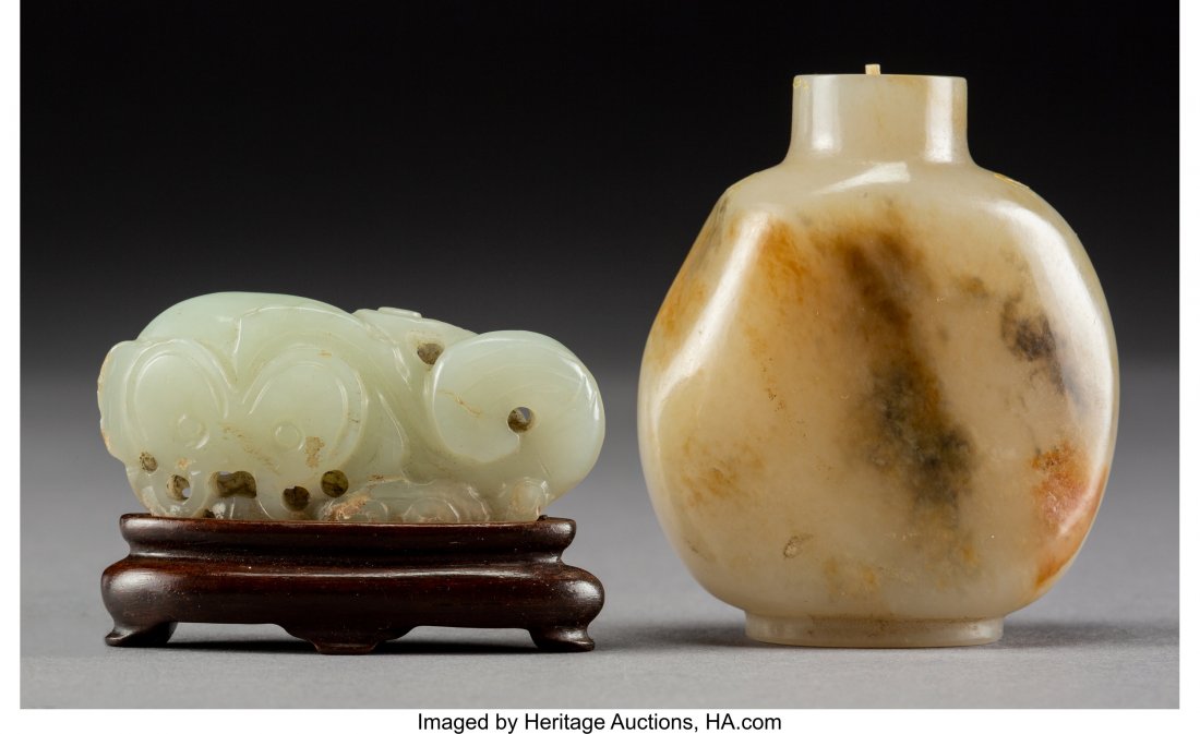 A Chinese Carved White Jade Pebble-Form Snuff Bo: A Chinese Carved White Jade Pebble-Form Snuff Bottle and Vegetable Carving on Hardwood Stand,