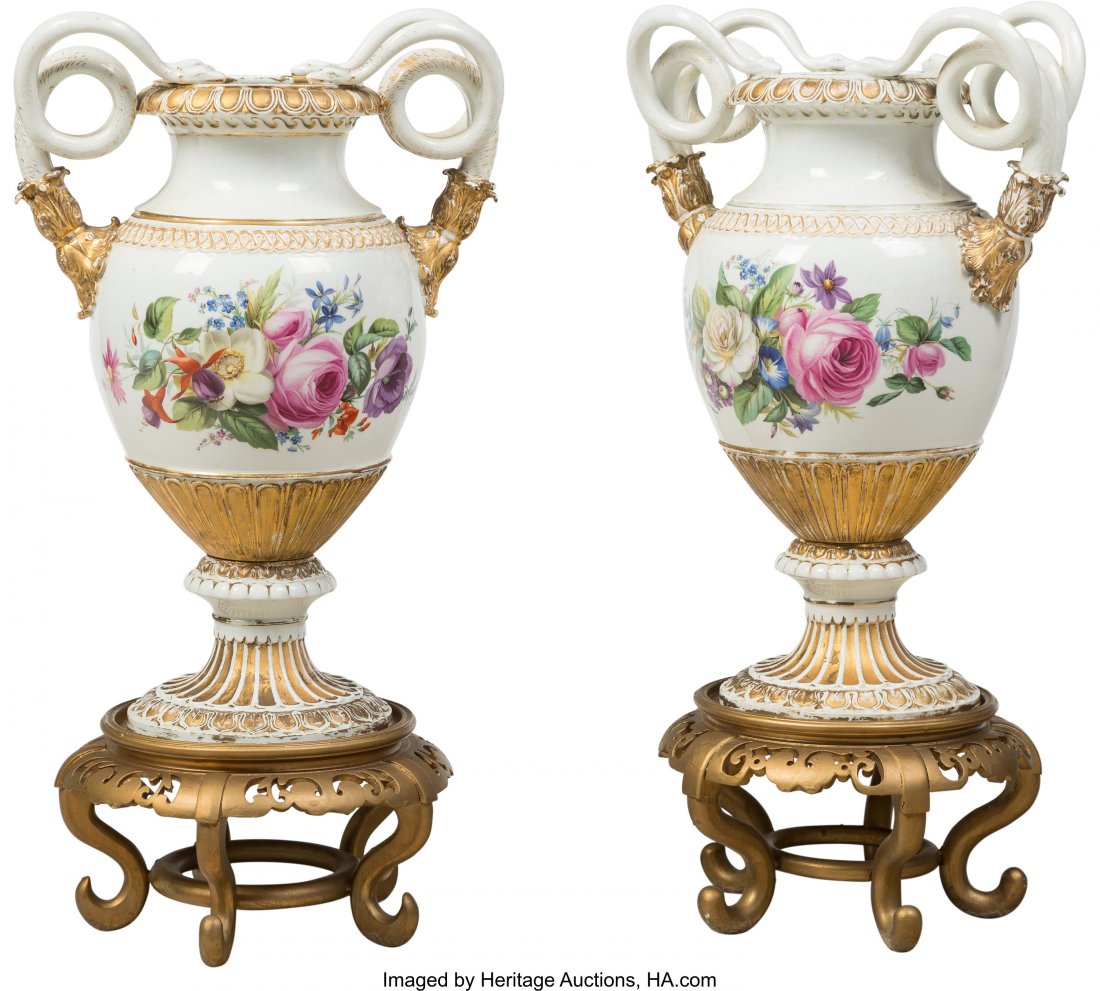 A Pair of Meissen Polychromed and Gilt Porcelain: A Pair of Meissen Polychromed and Gilt Porcelain Snake-Handled Vases on Giltwood Stands, 