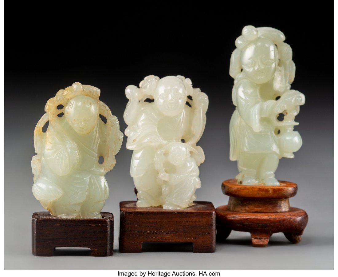 A Group of Three Chinese White Jade Figural Carv: A Group of Three Chinese White Jade Figural Carvingson Hardwood Stands, Qing Dynasty 2-7/8