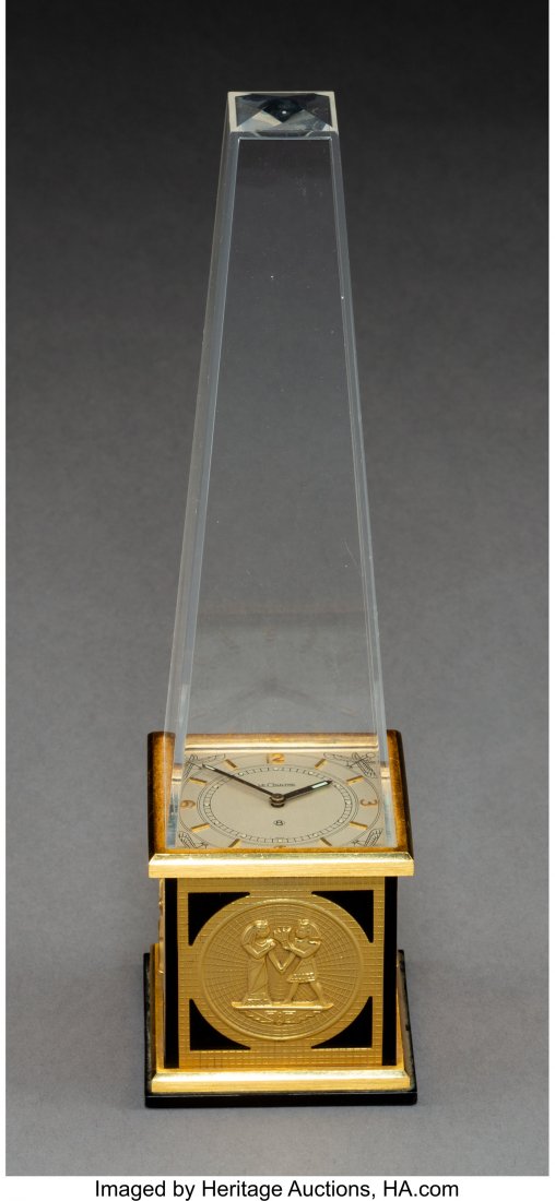 A Jaeger LeCoultre Brass & Plastic Egyptian Revi: A Jaeger LeCoultre Brass & Plastic Egyptian Revival-Style Obelisk-Form Table Clock, Le Sentier, Le Chenit, Switzerland, 20th century Marks: LE COULTRE, LE COULTRE CS, SWISS, 462 9-1/2 x 2-1/2 x 2-