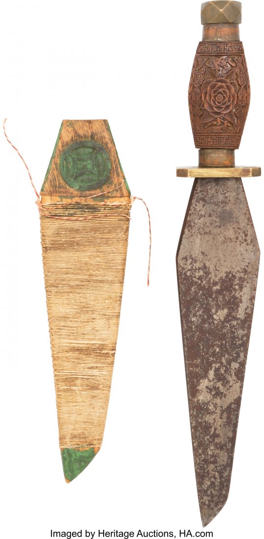 Interesting Primitive Knife. Approximately 9 1/: Interesting Primitive Knife. Approximately 9 1/2- inch steel blade. Swelled design with multiple angles. Intricate Carved Wood handle with a highlighted detailed rose design one one side. A tribal pat