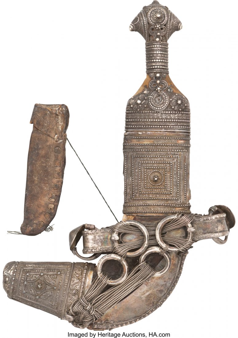 Middle Eastern Jambiya. 7-inch curved blade of : Middle Eastern Jambiya. 7-inch curved blade of standard form. Great design, pattern on punch dot engraving pattern throughout with rings in between silver string. Silver ornaments. Repousee and filigr