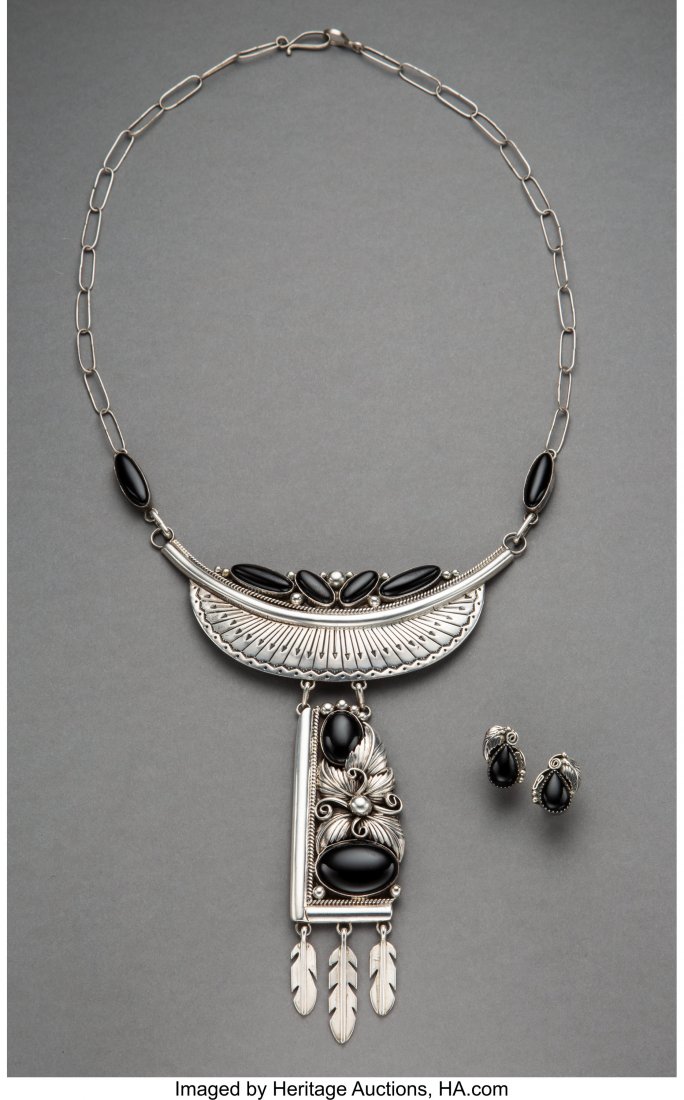 A Navajo Necklace with Matching Earrings neckl: A Navajo Necklace with Matching Earrings necklace stamped BJ (possibly Benjamin Jones), Sterling Length of necklace: 16 inches HID03101242017