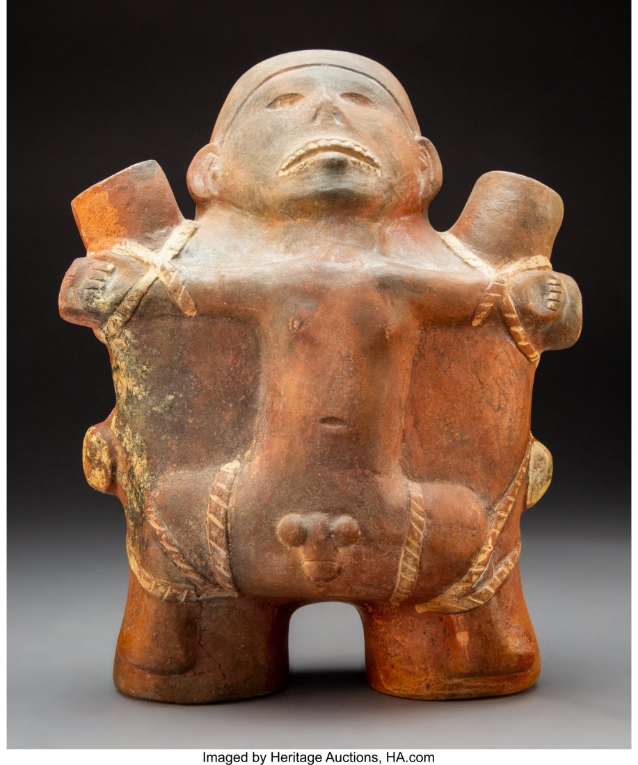 A Moche Sacrificial Prisoner c. 400 - 700 AD R: A Moche Sacrificial Prisoner c. 400 - 700 AD Reddish brown hollow earthenware with cream painted details. An extraordinary sculpture, with the naked male prisoner spread-eagled, his limbs bound with r