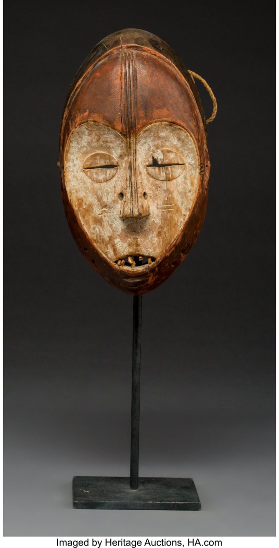 A Lega Mask Democratic Republic of Congo Wood: A Lega Mask Democratic Republic of Congo Wood face mask with traces of kaolin and camwood. Provenance: Dr. & Mrs. John Finley Height: 8 ½ inches HID03101242017