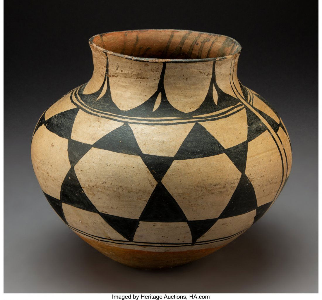 A Santo Domingo Polychrome Jar c. 1910 clay, p: A Santo Domingo Polychrome Jar c. 1910 clay, paint Diameter: 10 ½ inches HID03101242017