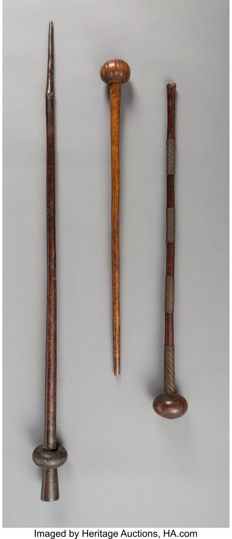 A Group of Three Clubs South Africa Finely pat: A Group of Three Clubs South Africa Finely patinated war clubs, wood and metal. Provenance: Dr. & Mrs. John Finley Heights: ranging from 32 ½ to 50 inches HID03101242017