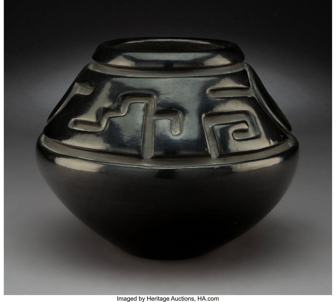 A Santa Clara Carved Blackware Jar Margaret Tafo: A Santa Clara Carved Blackware Jar Margaret Tafoya c. 1970 clay, paint, signed on the base, Margaret Tafoya Provenance: Professor Julia R. Weertman Collection Diameter: 8 inches HID03101242017