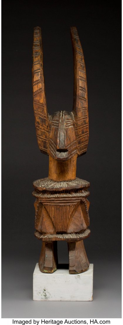 An Igbo Ikenga Figure Nigeria Wood, a cylindri: An Igbo Ikenga Figure Nigeria Wood, a cylindrical body carved with panels of hatched ornaments. Provenance: Dr. & Mrs. John Finley Christie's South Kensington, October 2, 1990, lot 279 Pitt Rivers Mus