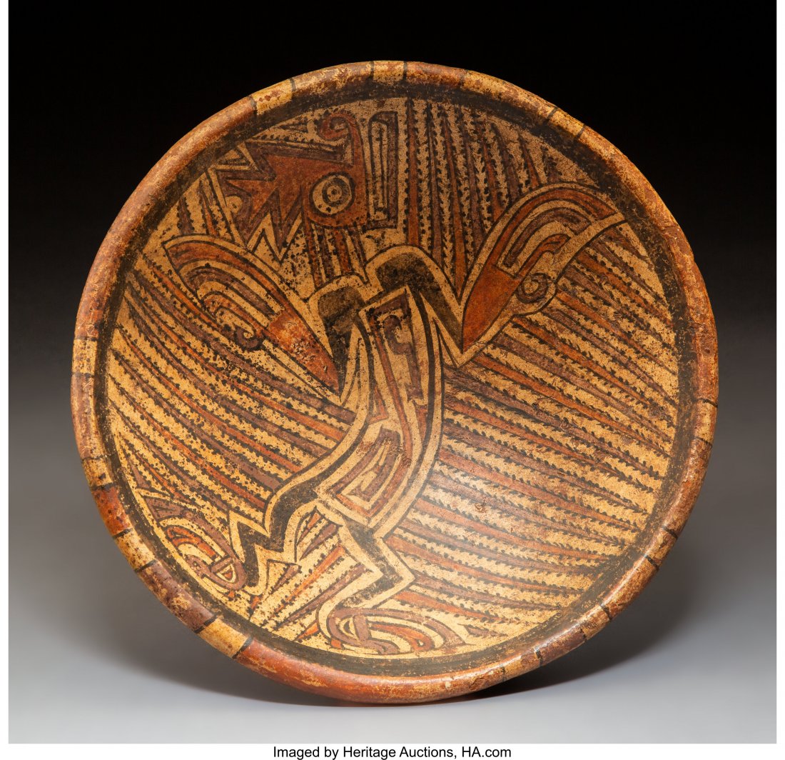 A Cocle/Macaracas Pedestal Plate c. 800-1500 AD: A Cocle/Macaracas Pedestal Plate c. 800-1500 AD Earthenware with polychrome paints in purple, red-orange, black and cream. Depicts a dancing shaman in transformation to a saurian with a crested head, 