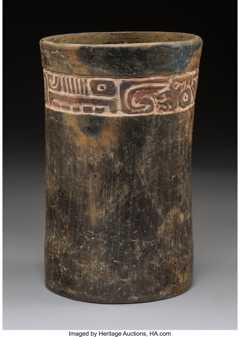 A Maya Blackware Cylinder with Carved Glyph Band: A Maya Blackware Cylinder with Carved Glyph Band Height: 9 ½ inches HID03101242017