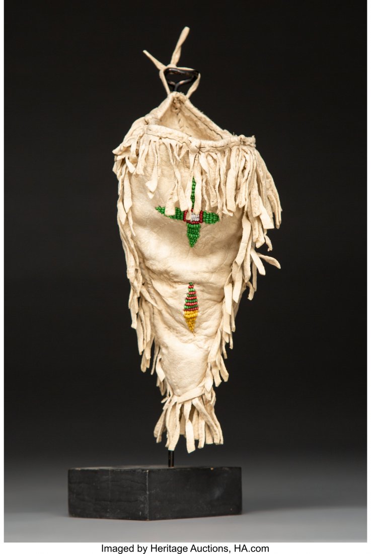 A Sioux Woman's Beaded Hide Pouch Provenance:: A Sioux Woman's Beaded Hide Pouch Provenance: William & Sheryl Sloup Collection Height: 7 inches HID03101242017