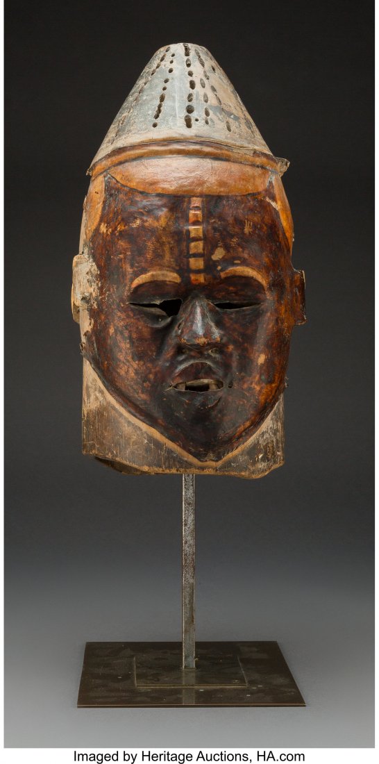 An Ibo Skin Covered Janus-head Helmet Mask Hei: An Ibo Skin Covered Janus-head Helmet Mask Height: 16 ½ inches HID03101242017