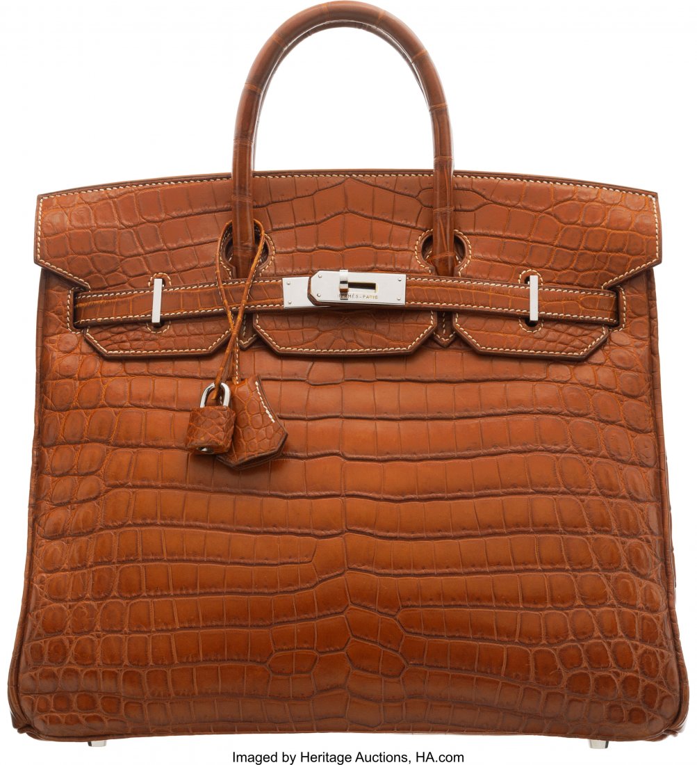 Hermès 30cm Miel Niloticus Crocodile HAC: Hermès 30cm Miel Niloticus Crocodile HAC Birkin Bag with Palladium Hardware D Square, 2000 Condition: 2 12" Width x 11" Height x 6.5" Depth This bag is done in Miel Niloticus Crocodile with Pal