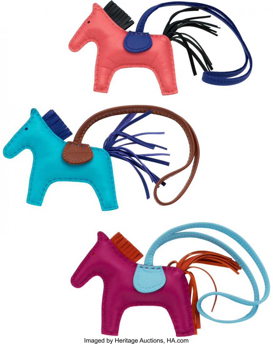 Hermès Set of Three: Rodeo TPM Charms Con: Hermès Set of Three: Rodeo TPM Charms Condition: 1 3.5" Width x 3" Height This set includes: Hermès Rose Pourpre, Carnelian & Blue Celeste Swift Leather Rodeo TPM Charm Hermès