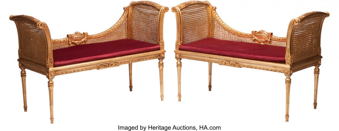 A Pair of Louis XVI-Style Caned Giltwood Settees: A Pair of Louis XVI-Style Caned Giltwood Settees 33 x 48 x 30 inches (83.8 x 121.9 x 76.2 cm) (each) Each with red cushions. HID03101242017