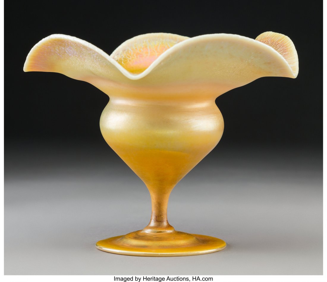 Tiffany Studios Favrile Glass Floriform Footed V: Tiffany Studios Favrile Glass Floriform Footed Vase, circa 1920 Marks: L. C. Tiffany - Inc., Favrile, 1529, 9263M 4-7/8 x 5-7/8 x 5-7/8 inches (12.4 x 14.9 x 14.9 cm) HID03101242017