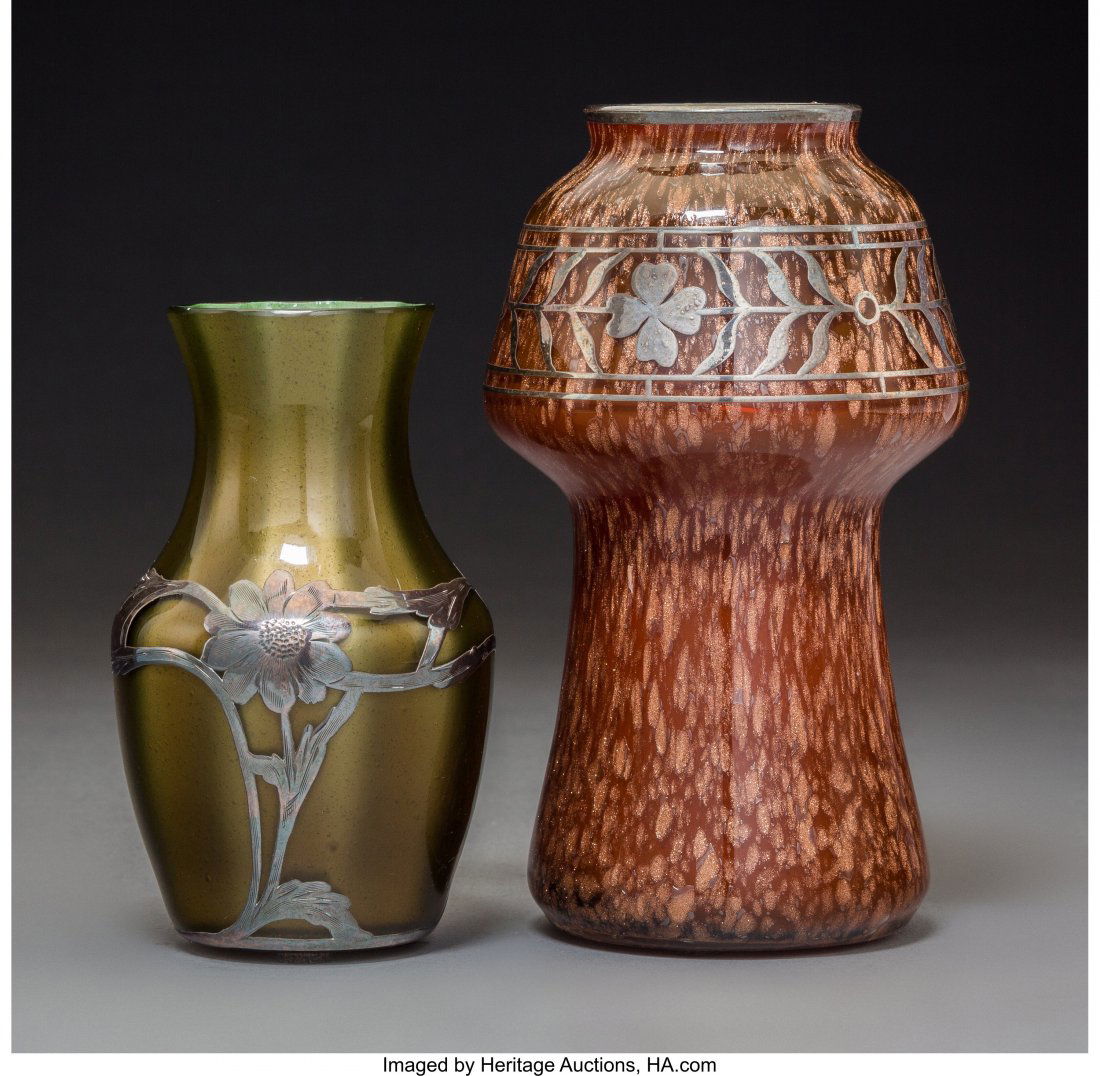 Two Loetz Glass Vases with Applied Overlays, cir: Two Loetz Glass Vases with Applied Overlays, circa 1900 Marks to Metallin vase: 599, 03245-1 6-1/8 inches (15.6 cm) The lot comprising: 1 Metallin vase with silver overlay; 1 Ausführung 83 with s