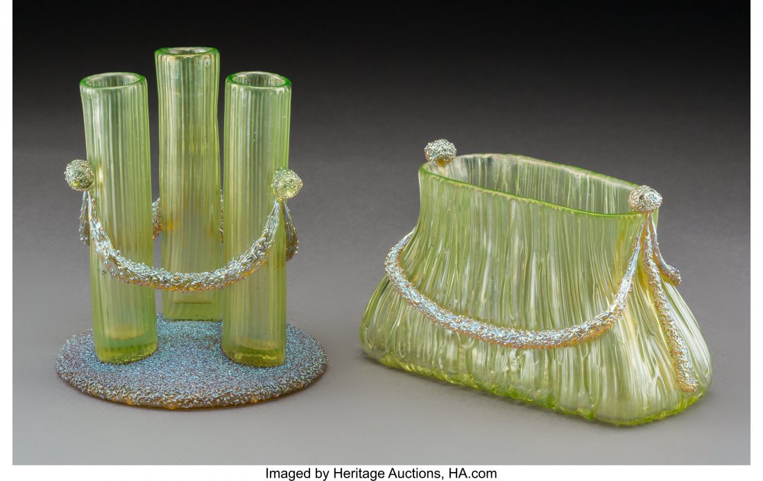 Two Loetz Titania Empire Glass Vases, circa 1904: Two Loetz Titania Empire Glass Vases, circa 1904 5-3/4 x 5 x 5 inches (14.6 x 12.7 x 12.7 cm) (taller, three bud vase) The lot comprising a three bud vase and a purse-form vase. HID03101242017