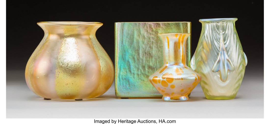 Four Loetz Glass Table Articles, circa 1905 3-7/: Four Loetz Glass Table Articles, circa 1905 3-7/8 inches (9.8 cm) (tallest) The lot comprising: 1 Silberiris square vessel; 1 Silberstreifen jar; 1 Coppelia PN II-1871 vase; 1 Astraea vase. 4 Total HI