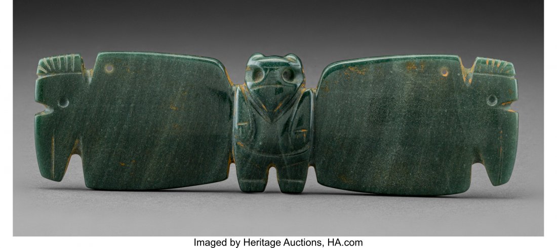 A Large Jade Bat-Wing Pendant Costa Rica, c. 10: A Large Jade Bat-Wing Pendant Costa Rica, c. 100 - 700 AD Superbly carved from dark green veined jade with a high polish, depicts a charming birdman at center between to large wings terminating in tou