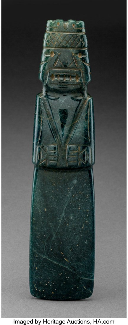 A Large and Important Jade Axe God Pendant Cost: A Large and Important Jade Axe God Pendant Costa Rica, c. 100 – 700 AD Carved from a very fine dark blue-green jade of thick section with a high polish. The figure boldly and flawlessly grooved 