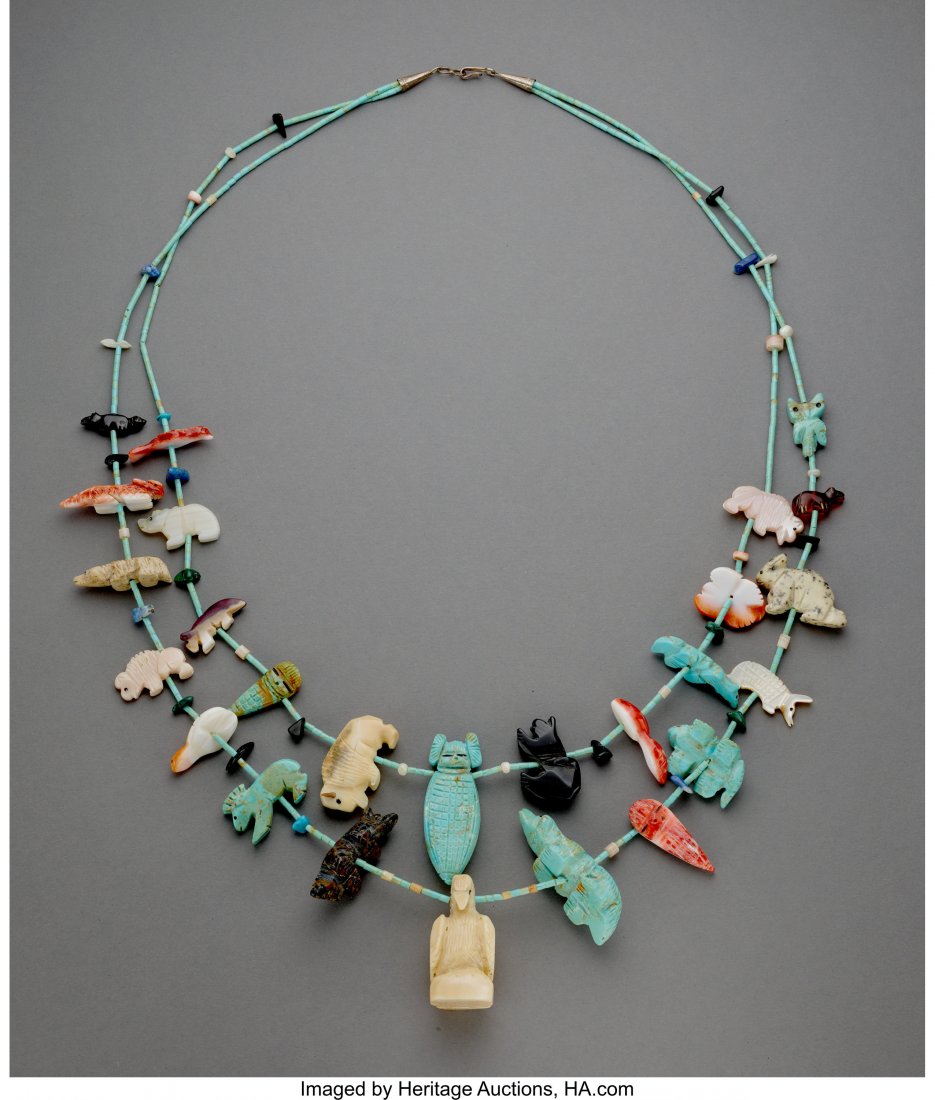 A Navajo Fetish Necklace c. 1985 with bear, bu: A Navajo Fetish Necklace c. 1985 with bear, buffalo, owl, turtle, frog, eagle and kachina corn maiden depicted, silver, various stones Length: 17 inches HID03101242017