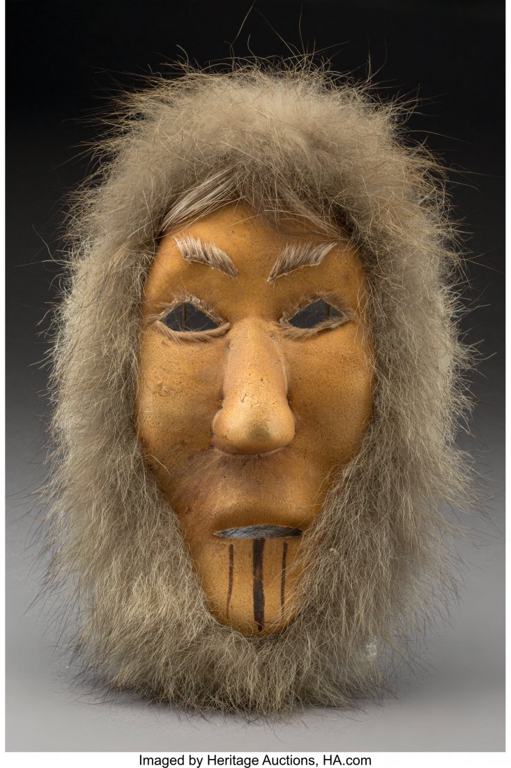 An Eskimo Hide and Fur Mask Height: 12 inches o: An Eskimo Hide and Fur Mask Height: 12 inches overall HID03101242017