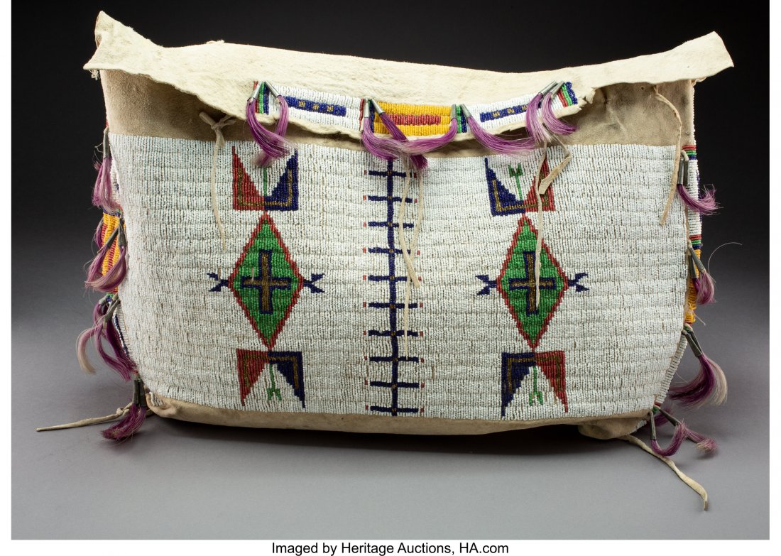 A Sioux Beaded Hide Tipi Bag c. 1890 hide, bra: A Sioux Beaded Hide Tipi Bag c. 1890 hide, brass and glass seed beads, sinew, metal cones, dyed horse hair Width: 22 inches HID03101242017