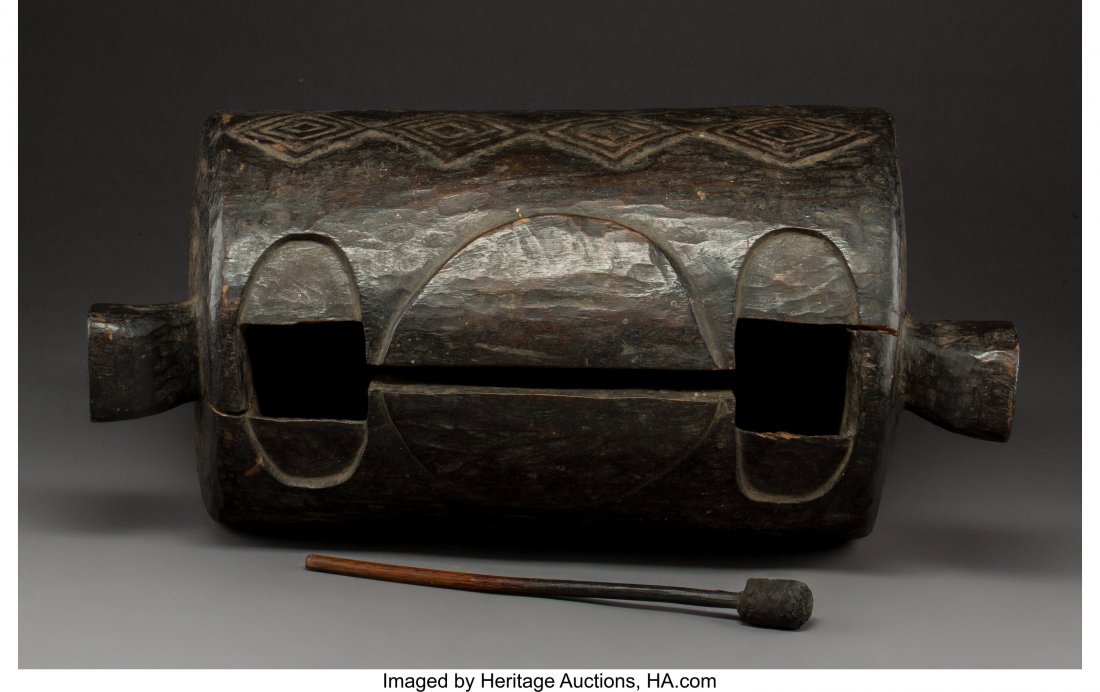 A Dengese Drum and Mallet Democratic Republic o: A Dengese Drum and Mallet Democratic Republic of Congo Darkened heavy wood, cloth attached to mallet. A drum, called pekoe, used by members of the ikoho hunting association. In very good condition wit