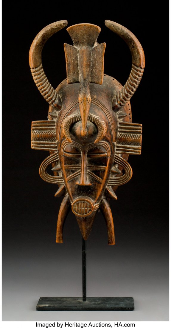A Senufo Kpelie Mask Wood with polish and patin: A Senufo Kpelie Mask Wood with polish and patina from use and age. Provenance: Dr. & Mrs. John Finley Height: 14 inches HID03101242017