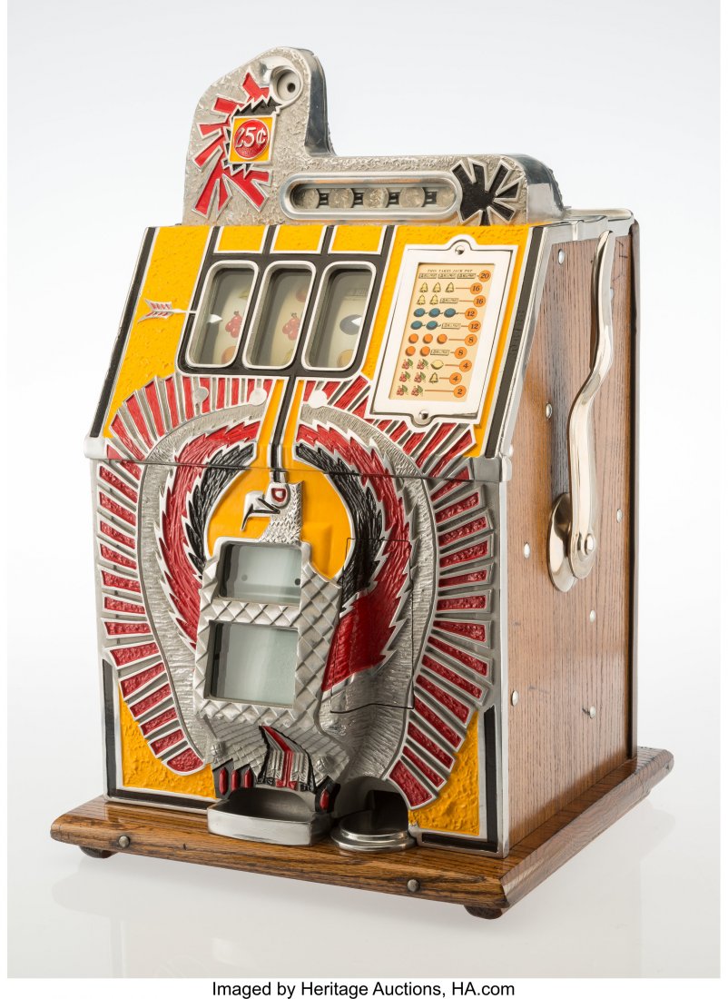 A Mills Novelty Co. War Eagle Enameled Metal and: A Mills Novelty Co. War Eagle Enameled Metal and Oak Twenty-Five Cent Three-Reel Slot Machine, circa 1931 Marks: MILLS NOVELTY CO, CHICAGO, U.S.A., TRADE MARK, GENUINE MILLS MACHINES, BEAR A TRADE MAR