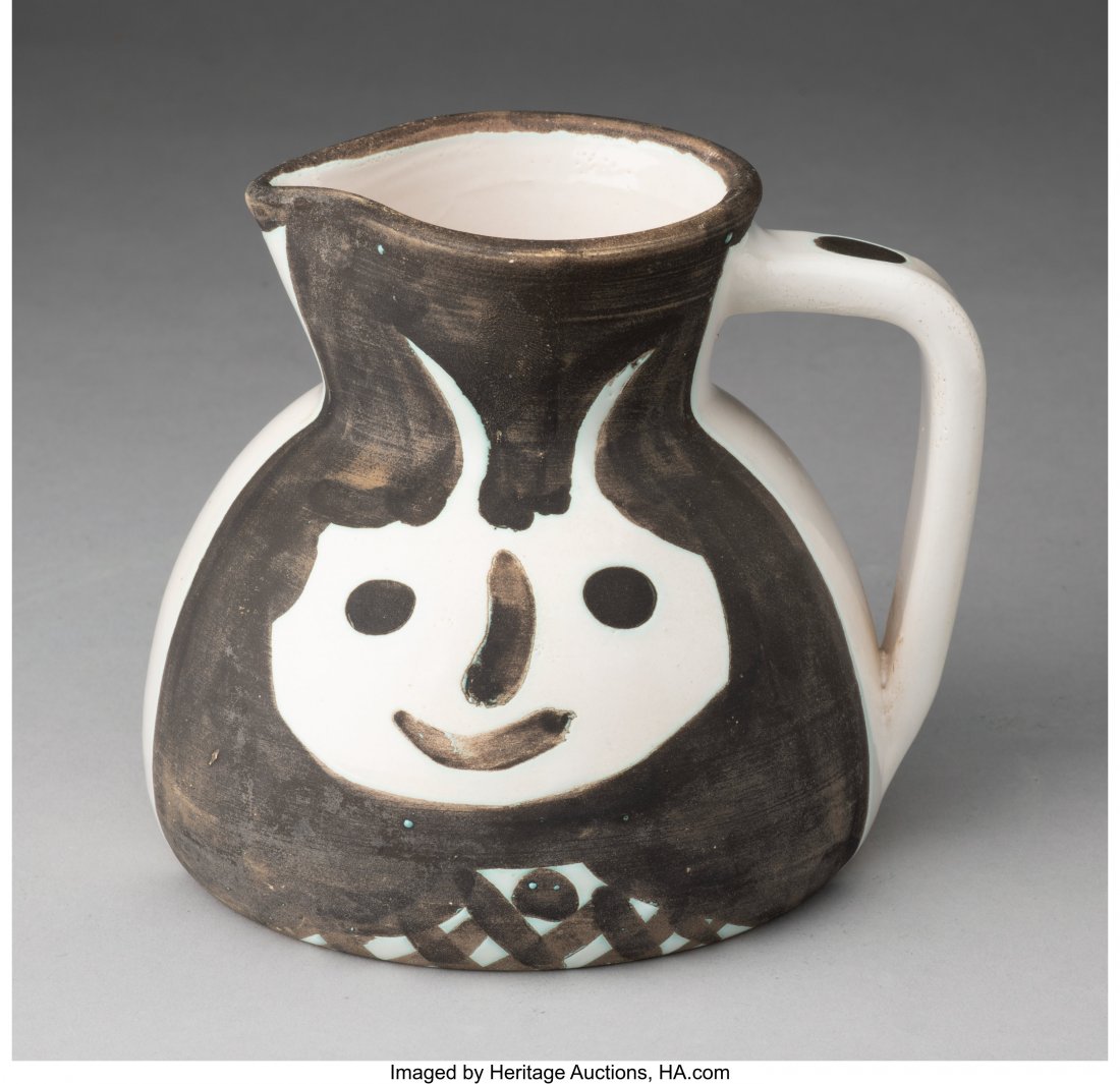 Pablo Picasso (1881-1973) Têtes, 1959 Whi: Pablo Picasso (1881-1973) Têtes, 1959 White earthenware ceramic pitcher painted in white and black with partial glazing 5-7/8 x 5-1/8 x 5-1/8 inches (15 x 13 x 13 cm) Edition of 500 Inscribed 'E