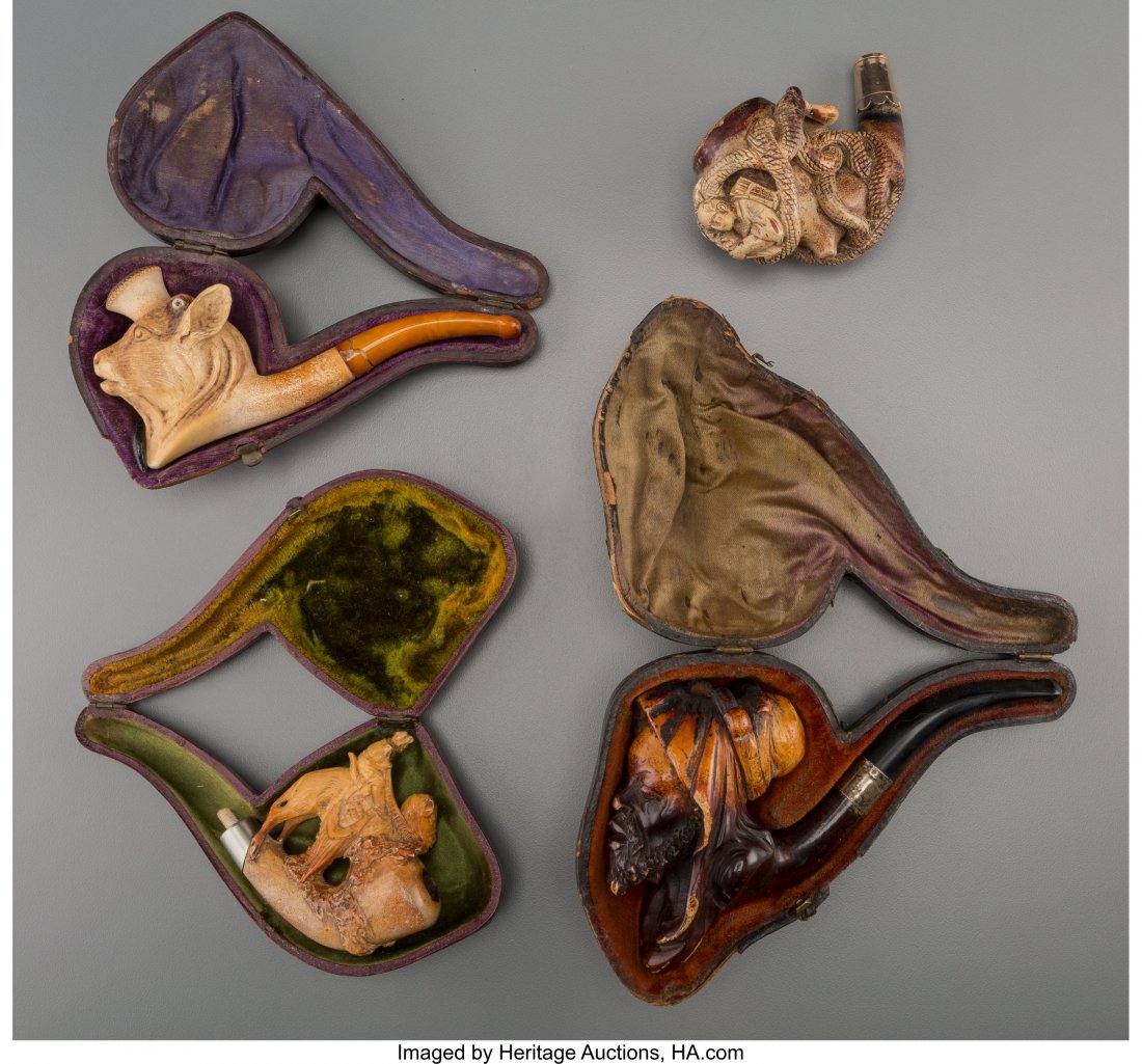 A Group of Four Meerschaum Pipes and Pipe Bowls,: A Group of Four Meerschaum Pipes and Pipe Bowls, late 19th century 5-3/4 inches long (14.6 cm) (longest, Moor) The group including a pipe in the form of a Moorish man, a oxen head-form pipe, a narrow 