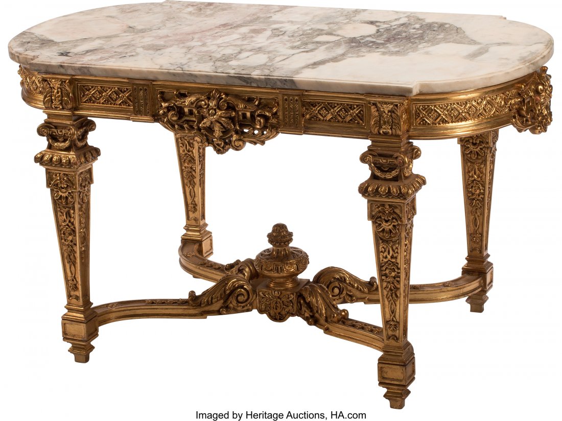 A French Louis XV-Style Gilt Carved Hardwood Cen: A French Louis XV-Style Gilt Carved Hardwood Center Table with Marble Top 30 x 53 x 28-1/2 inches (76.2 x 134.6 x 72.4 cm) The center table with elongated oval marble top, above apron with diamond pat
