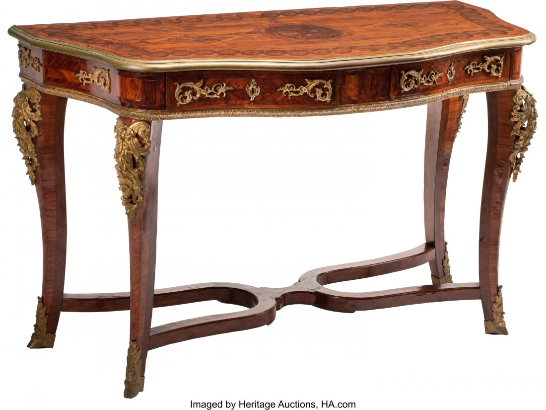 A Regence Gilt Bronze Mounted Oyster Work and Pa: A Regence Gilt Bronze Mounted Oyster Work and Parquetry Inlaid Hardwood Console Table, 18th century 35 x 58 x 26 inches (88.9 x 147.3 x 66.0 cm) The console table with serpentine marquetry top, atop t