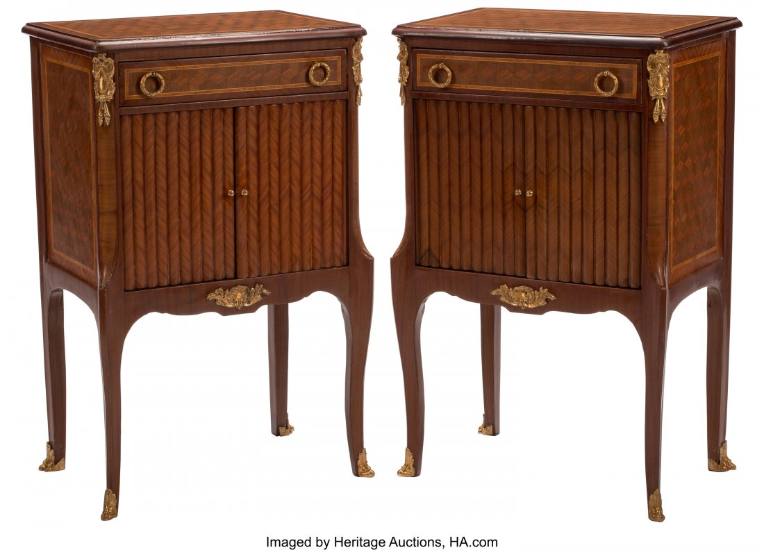 A Pair of French Transitional-Style Gilt Bronze : A Pair of French Transitional-Style Gilt Bronze Mounted Parquetry Inlaid Nightstands 33 x 21 x 14 inches (83.8 x 53.3 x 35.6 cm) (each) The pair of nightstands, with rectangle tops, above single top d