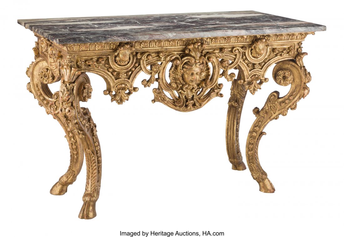 A Continental Baroque-Style Carved Giltwood Cons: A Continental Baroque-Style Carved Giltwood Console Table with Marble Top, 19th century 34-3/8 x 52-3/8 x 27-1/2 inches (87.3 x 133.0 x 69.9 cm) PROPERTY FROM THE COLLECTION OF JOHN ROBERT CLARK, DALL